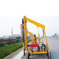 Hydraulic flex beam guardrail pile driving highway guardrail installation machine